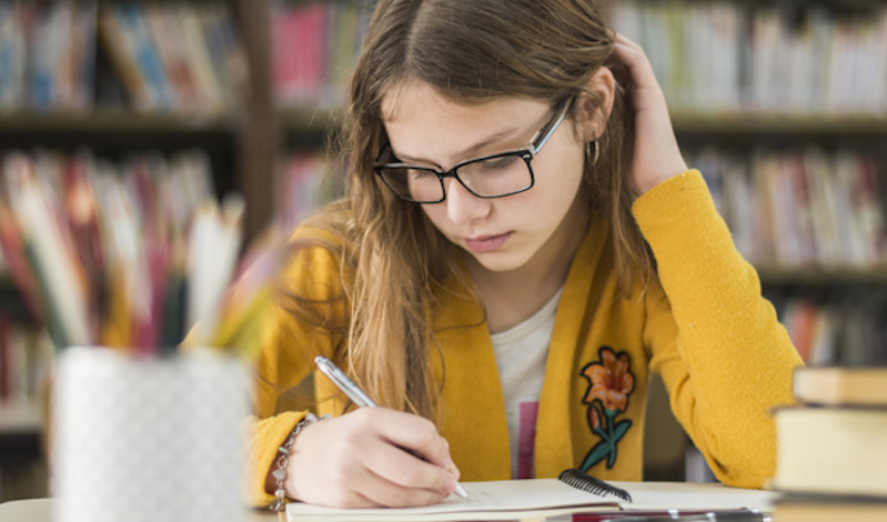smart-girl-studying-library_23-2147863582